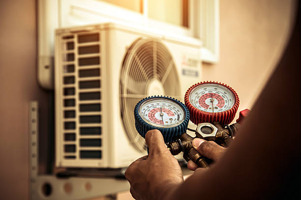 Professional Air Conditioning Service technician working in New Roads, LA